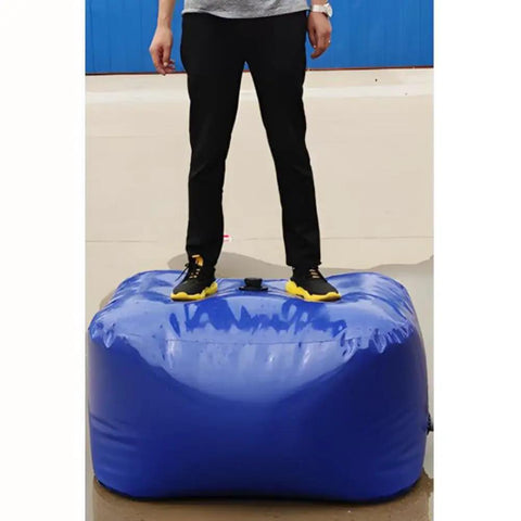 Person standing on Must Have Foldable PVC Water Tank 240L Portable Water Storage Bladder For Camping RV Emergency Water Outdoor