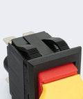 Close-up of Dual Voltage Emergency Stop Paddle Switch 16 Amp, featuring a red and yellow paddle, designed for safety on power tools.