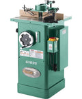 Built Like A Tank One Point Five Horsepower Woodworking Shaper Featuring Massive Twenty By Eighteen Inch Cast Iron Table And Dual Voltage Motor.