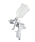 Mini Pneumatic Paint Sprayer Featuring 1.0 Mm Brass Flow Cap And Corrosion Resistant Needle For Straightforward Auto Detailing And Slick Finish Airbrush Jobs Built Tough For Top Shelf Durability, side view showing clear cup.