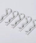 R Shape Cotter Pins Set 150 Pieces Carbon Steel Small Metal Spring Pins Close-up on Light Gray Surface