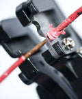 Close-up of Heavy Duty Automatic Wire Cutter and Stripper removing insulation from wire, showing blade action.