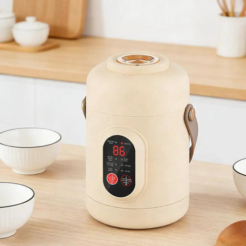 Grab And Go 800Ml Capacity 500W Electric Pot Mini Cooker With Stainless Steel Build And Nine Hour Keep Warm on a table