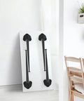 28 Inch Folding Table Legs Set Of 4 In Matte Black Beefy Heavy Duty Steel with Foldable Design shown against a white wall