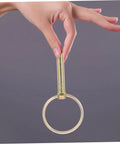 Hand holding a pin from 12 Piece Beefed Up Tractor Trailer Hitch Pins Kit With Heavy Duty Retaining Pins And Rings for secure towing.