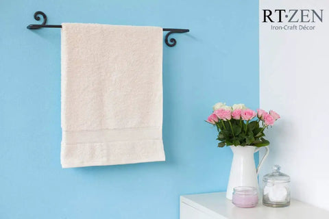 Farmhouse Style Matte Black Wrought Iron Towel Holder, Wall Mounted Towel Bar For Bathroom And Kitchen with a white towel