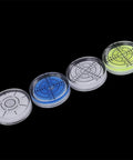 Four 32mm for acrylic Bubble Level Round Circular for spirit Gauge(1) in clear, blue, white, and yellow colors on a dark background.