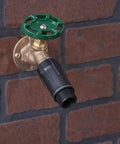 Three Quarter Inch Hose Pressure Regulator For Drip Irrigation attached to outdoor spigot, reduces water pressure to 25 to 30 PSI