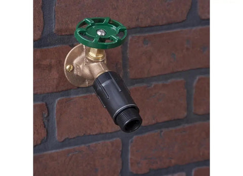 Three Quarter Inch Hose Pressure Regulator For Drip Irrigation attached to outdoor spigot, reduces water pressure to 25 to 30 PSI
