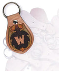Close-up of a custom stamped brown leather key fob from the Snag This Solid DIY Key Fob Kit For Weekend Crafting Featuring Vegetable Tanned Leather.