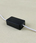Ten Pack Heavy Duty ABS Plastic Electronic Project Enclosures Black Wiring Junction Boxes 1.89 X 1.02 X 0.61 Inches with white wire attached.