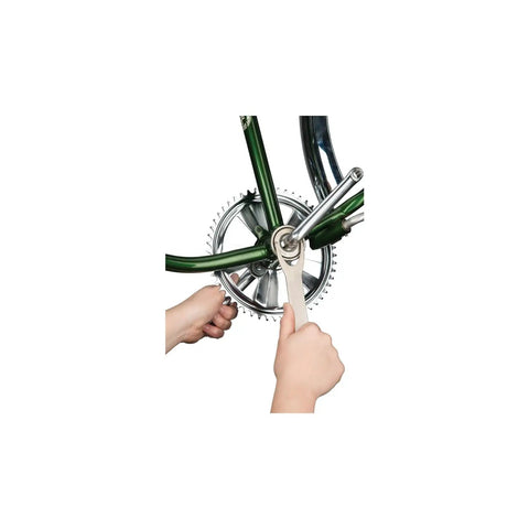 Using Beefy Bottom Bracket Wrench for Bicycle Maintenance And Repair on a bike's bottom bracket with grippy steel tool.