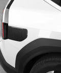 Premium ABS EV Charging Port Cover Trim For Hyundai Kia EV9 2024 To 2025, featuring carbon fiber pattern on side view.