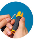 Lil Ripper Wire Stripper with V-notch used for NM cable stripping, showing ergonomic grip and precise wire removal.