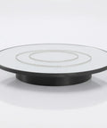 Top Tier Electric Rotating Display Stand For Jewelry And Accessories showing silver chain on black turntable, smooth 360 degree view.