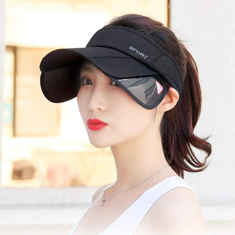 Women Sun Visor Hat With Retractable Brim And Adjustable Fit For Golf Beach And Tennis Use Breathable Lightweight Cap With UV Protection And A Wide Shade For All Day Comfort Go To Black worn by a woman outdoors