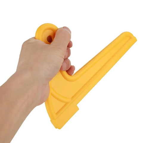 Hand holding the 2 Pack V Type Woodworking Push Sticks Safety Push Blocks for Table Saws Routers and Jointer ABS Yellow V Shaped Push Tool