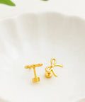 Gold Bow Stud Earrings For Women Titanium Flat Back Screw Back Hypoallergenic Nickel Free Lightweight on a white dish.