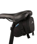 Under-seat view of 14 In 1 Bike Repair Tool Kit With Under Seat Saddle Bag For Road Mountain And Commuter Bikes attached to bike saddle.