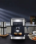 Top Shelf Electric Coffee Machine And Milk Frother Featuring Stainless Steel Build, dual espresso shots in transparent cups.