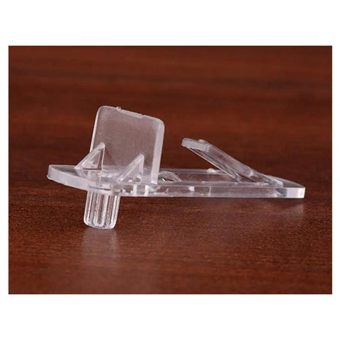 Close-up of a transparent plastic shelf pin and clip from Twenty Piece Set Self Locking Plastic Shelf Pins And Clips For Four Point Nine Millimeter Hole Size And Three Fourth Inch Thick Shelves Fits Kitchen Cabinets And Book Shelves Easy To Install