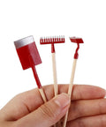 Person holding 1:12 Dollhouse Mini Garden Tool Set With Shovel Hoe And Pitchfork, Realistic Metal Tools With Wood Handles