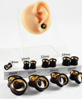 Two Tone Hollow Gold Stainless Steel And Sandalwood Ear Tunnels Plugs Set For Stretched Ears 0G To 1 Inch on display
