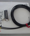 Keyence FU-77TZ Fiber Optic Sensor Replacement Module with cable and connectors on packaging