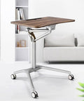 Level Up Your Grind With This Mobile Standing Laptop Desk featuring smooth pneumatic height adjustment and heavy duty rollable casters.