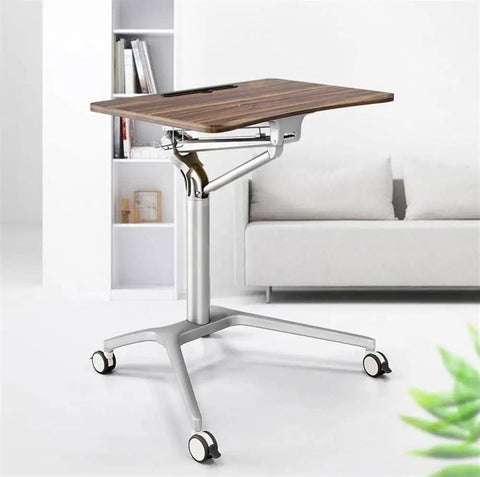 Level Up Your Grind With This Mobile Standing Laptop Desk featuring smooth pneumatic height adjustment and heavy duty rollable casters.