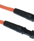 Orange fiber optic cable with black connectors on both ends