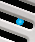 Close-up of Slim SLM70H No Frills Exhaust Bath Fan With Humidity Sensor's blue LED indicator through vent slats.