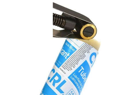 Tube Wax Lubricant For Sanding Belts And Discs Solid Wax Stick held by clamp tool