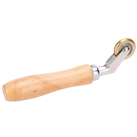 Side view of wooden-handle steel seam roller with brass wheel for roofing membrane application.