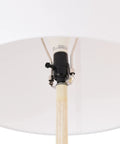Close-up of E26 base and rotary switch of 65 Inch Floor Lamp With Wood Toned Finish And White Cotton Shade Japandi Style.