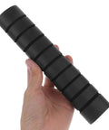 Hand holding a black Three Pack Pull Up Bar Grip Sleeve with Anti Slip Sponge Pads for Non Skid Hand Guards