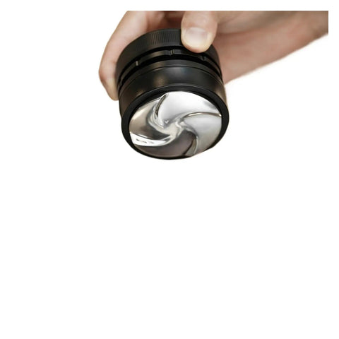 Top Tier Espresso Coffee Distributor And Leveler With Adjustable Depth For 58.35mm Portafilters, heavy steel, hand-held view.