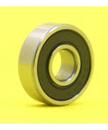 Heavy Duty 607 Hybrid Ceramic Ball Bearings With Si3N4 Balls And Steel Rings For High Speed Motor Spindles And Industrial Machines ABEC-1 Precision Smooth Running Setup on a yellow background.