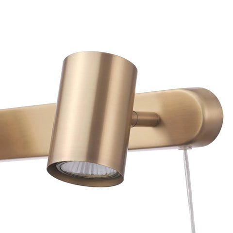 Close-up of a matte brass adjustable head from Three Light Plug-In Track Lighting in Matte Brass with adjustable heads, 15-foot cord.