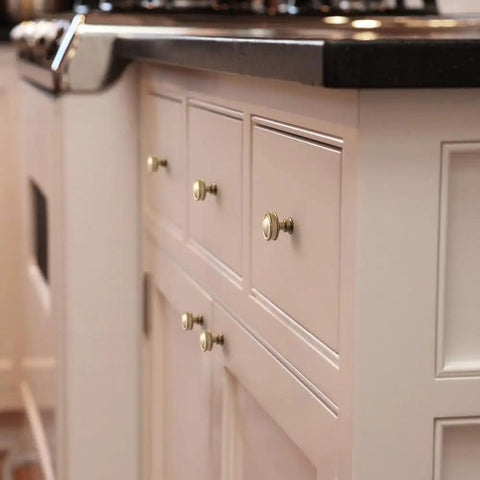 Champagne Bronze Round Cabinet Knobs Six Pack With Smooth Domed Top And Subtle Flared Base For A Polished, Modern Kitchen Look On Cabinets And Drawers, Easy To Install installed on kitchen cabinetry