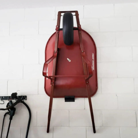 Heavy Duty Wall Mount Ladder Hanger for Garage Storage and Organization Space Saving Tool Holder with red wheelbarrow mounted