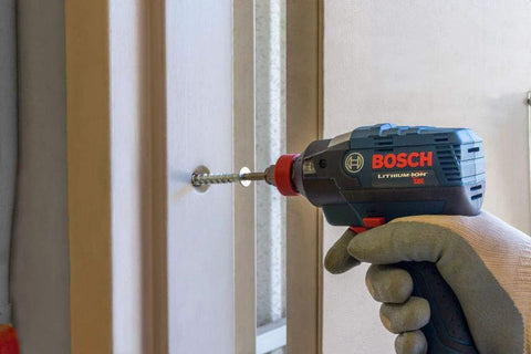 THDB25234CS Titen HD 1/4 Inch By 2-3/4 Inch Zinc Plated Countersunk Head Heavy Duty Screw Anchor being used with a drill on a door frame