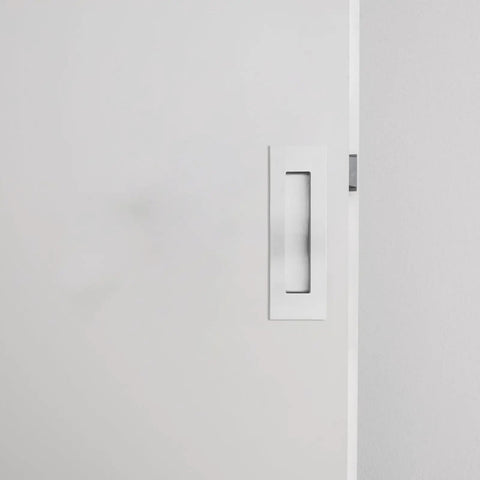 Close-up of Invisible Door Handle Replacement Kit For Stainless Steel Recessed Door Pulls on a white door.