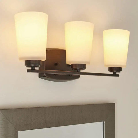 Three Light Wall Bath Fixture In Burnt Sienna Bronze Finish, Franport Collection; sleek wall sconce with warm lighting.