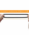 Hands holding a Universal Sewing Machine Stretch Motor Belt 13 To 15 Inch Easy Fit Replacement Belts 2 Pack, showing stretchability.