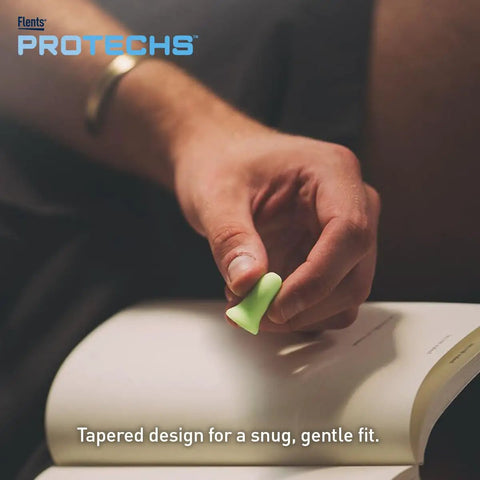 Person holding a green foam ear plug from Multi Purpose Foam Ear Plugs With Case For Sleep Travel Work Concerts Shooting Snoring Studying And Loud Noise Reduction NRR 33 Green Made In USA 10 Pairs, illustrating the tapered design for comfort.