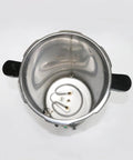 Stainless steel autoclave inner chamber with wired heater and mounting plate; side handles visible