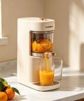 Awesome Electric Juicer With Wide Feed Chute For Maximum Juice Extraction, extracting fresh orange juice on countertop.