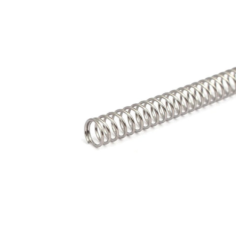 Close-up of a 304 stainless steel compression spring with 6 mm outer diameter and 0.6 mm wire, silver tone