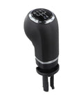 Sleek Black And Silver Manual Gear Shift Knob For Opel Cars Perfect Upgrade For 5 Or 6 Speed Manuals Simple DIY Install No Tools Needed To Spice Up Your Ride Today. Black and silver plastic and metal manual gear shift knob for Opel cars, top view.